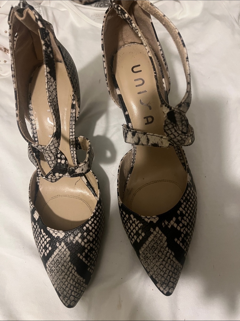 Unisa Snake-Print Pointed Toe Ankle-Strap Heels in Black and Tan